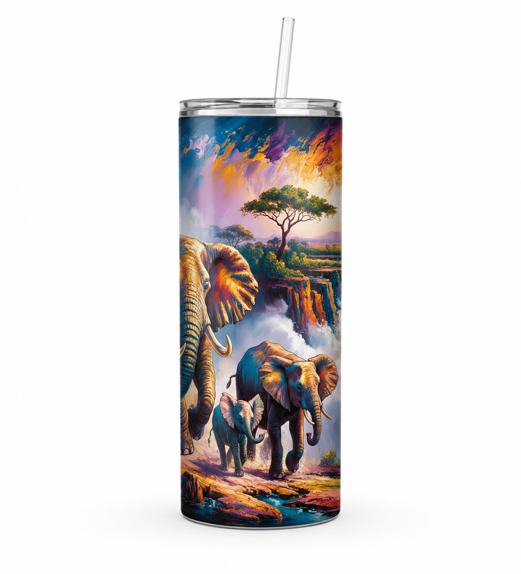 A tall insulated tumbler with a clear straw, featuring a colorful printed safari scene with elephants, a tree, and a dramatic sky. The tumbler is shown on a plain white background.