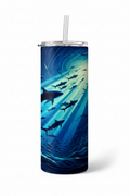 A tall insulated tumbler with a clear straw and clear lid, featuring an underwater shark design in shades of blue, teal, and black, shown on a white background.